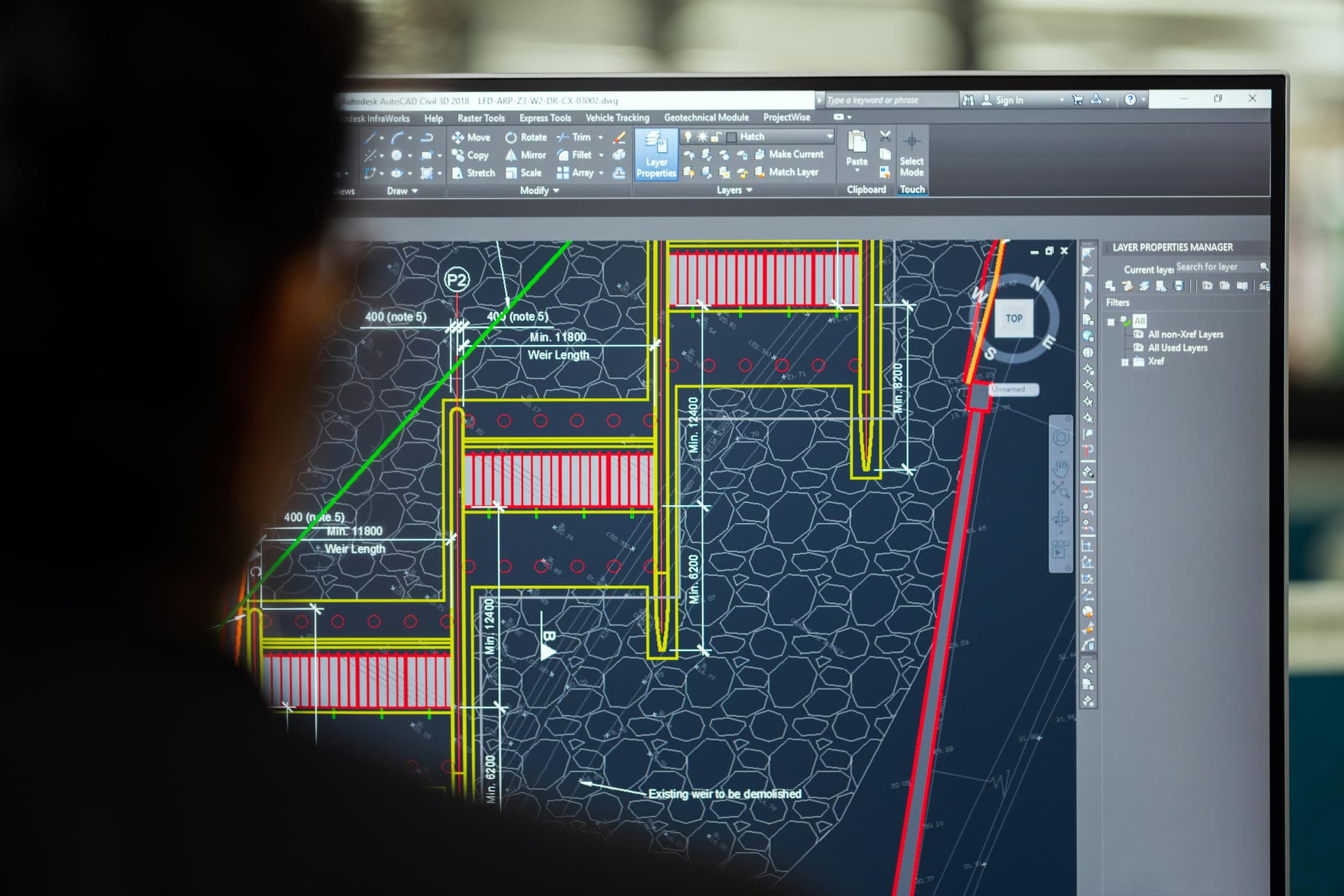 Engineer reviewing technical plans